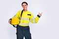 Photo of good mood smiling young firewoman dressed yellow uniform helmet looking pointing empty space isolated white