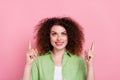 Photo of good mood woman with perming coiffure dressed stylish shirt look directing at sale empty space isolated on pink