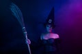 Photo of gorgeous lady magician frightening medieval people hold broomstick isolated on ultra violet color background Royalty Free Stock Photo