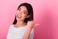 Photo of gorgeous satisfied person indicate thumb finger empty space blank isolated on pink color background Royalty Free Stock Photo