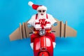 Photo of grandfather grey beard ride retro moped open mouth hold giftbox wear wings santa claus x-mas costume suspenders Royalty Free Stock Photo