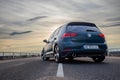 Photo of green car Volkswagen Golf GTI on the street Royalty Free Stock Photo