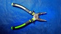 photo of green pliers Royalty Free Stock Photo