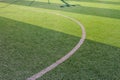Photo of a green synthetic grass sports field with white line shot from above Royalty Free Stock Photo