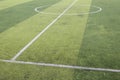 Photo of a green synthetic grass sports field with white line shot from above Royalty Free Stock Photo