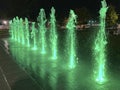 Green Water Fountain Light Display at Night