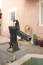 Green water pump in garden