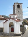 Photo of grey belfry of Temple Exaltation of the Holy and Life-giving Cross church in Stavros, Greece