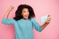 Photo of grimacing crazy excited overjoyed woman screaming in having completed level in game isolated pink pastel color Royalty Free Stock Photo