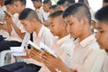 A group of Thai student in their school uniform is praying to th