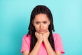 Photo of grumpy offended girl frowning grimace hands chin wear pink t-shirt isolated on blue color background
