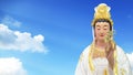 Guan yin the goddess of mercy statue with sky background Royalty Free Stock Photo