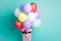 Photo of guy hide behind colorful hellium balloons wear formal cloth isolated on turquoise color background