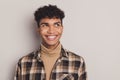 Photo of guy interested look empty space white smile wear plaid shirt rollneck isolated grey color background