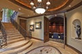 Hallway with stairway and open door in luxury mansion Royalty Free Stock Photo