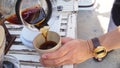 Hand drip coffee, barista pouring hot water over roasted grinded coffee powder making drip brew coffee Royalty Free Stock Photo