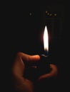 A photo of hand holding lighter Royalty Free Stock Photo