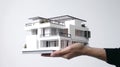 photo hand presenting model house for home loan campaign