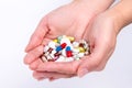 Photo handful full of pills and capsules of different colors