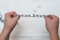 Photo of hands holding a broken chain Royalty Free Stock Photo
