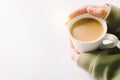 Photo hands holding hot cup of coffee in morning sunlight Royalty Free Stock Photo