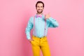 Photo of handsome adorable young guy dressed teal clothes showing thumb up smiling isolated pink color background