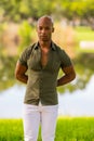 Photo handsome Black male model posing ith arms behind his back Royalty Free Stock Photo