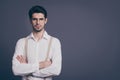 Photo of handsome business man hands crossed strict boss dressed formalwear white shirt beige suspenders specs isolated