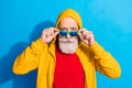 Photo of handsome cool confident hipster businessman in sunglass stare wear tracksuit isolated on blue color background Royalty Free Stock Photo