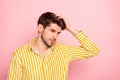 Photo of handsome guy holding hand in perfect hairdo style beauty treatment concept serene mood wear hipster striped