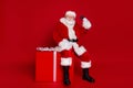 Photo of handsome positive retired man wear santa claus costume spectacles smiling buying credit card present isolated