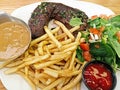 Hanger Steak Served With Sauce, French Fries and Salad