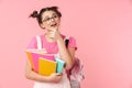 Photo of happy charming girl holding exercise books and dreaming Royalty Free Stock Photo