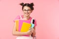 Photo of happy charming girl posing with exercise books and smiling Royalty Free Stock Photo