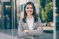 Photo of happy charming young business person confident crossed arms wear blazer in outside downtown