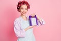 Photo of happy cheerful brown haired young woman hold display grater wear dotted apron good mood isolated on pink color