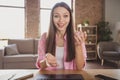 Photo of happy cheerful young woman speak web camera remote meeting internet seminar indoors inside house office Royalty Free Stock Photo