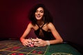 Photo of happy chic girl las vegas poker club visister play poker collect all chips bet million dollars win