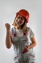 Photo of happy cute smiling good mood female construction worker isolated on white background Royalty Free Stock Photo