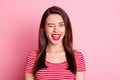 Photo of happy cute young woman blink wink eye good mood isolated on bright shine pink color background Royalty Free Stock Photo