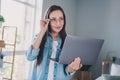 Photo of happy dreamy positive mature woman look imagine laptop work good mood indoors inside house home