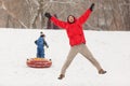 Photo of happy father and son on winter walk with tubing Royalty Free Stock Photo