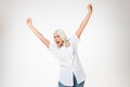 Photo of happy female pensioner 60s with gray hair raising her a Royalty Free Stock Photo