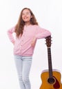 Photo of happy girl holding acoustic guitar over white background Royalty Free Stock Photo
