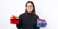 Photo of happy girl holding two gift boxes and looking at the camera Royalty Free Stock Photo