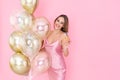 Photo of happy girl holds glass of champagne and many air balloons. came to party. Celebration Royalty Free Stock Photo