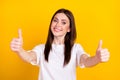 Photo of happy good mood positive lovely beautiful girl showing you thumb-up good job isolated on yellow color