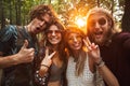 Photo of happy hippie people men and women, smiling and taking s Royalty Free Stock Photo