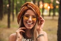 Photo of happy hippy woman, wearing stylish accessories smiling Royalty Free Stock Photo