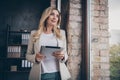 Photo of happy joyful dreaming woman holding tablet having rest after difficult work day contemplating her distant goals Royalty Free Stock Photo